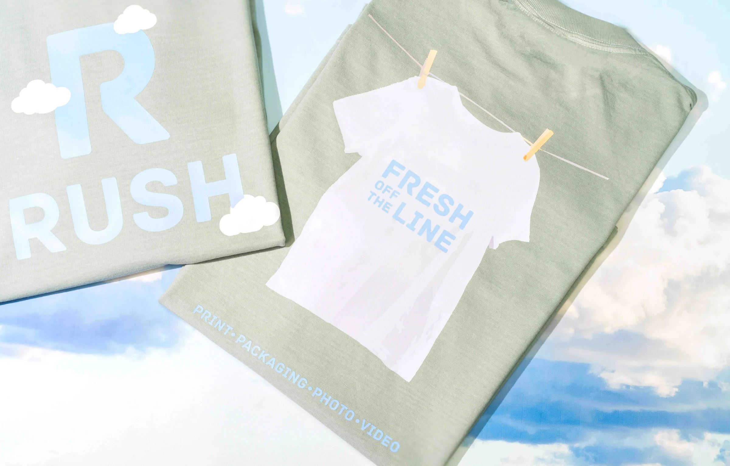 Two folded Rush spring tees on a sky of clouds: the R on the front, “Fresh off the line” on the back